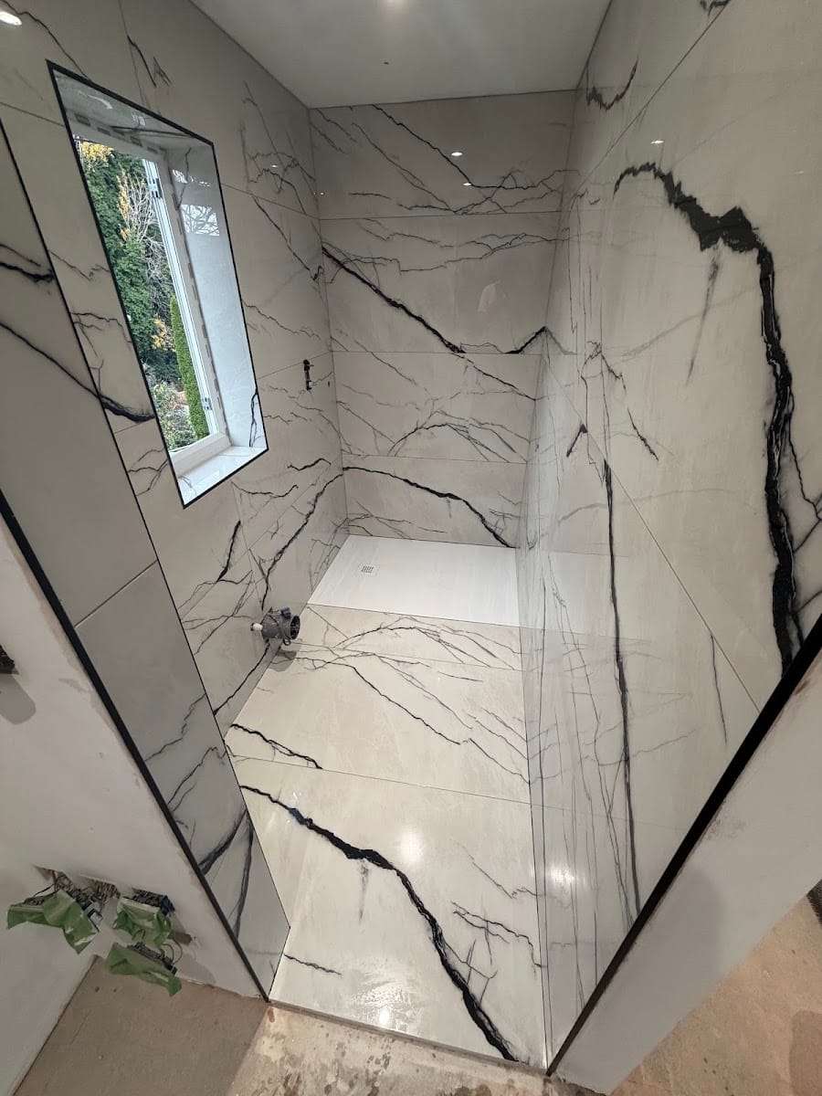 Marble effect walk in shower, by Cutting Edge Tiling