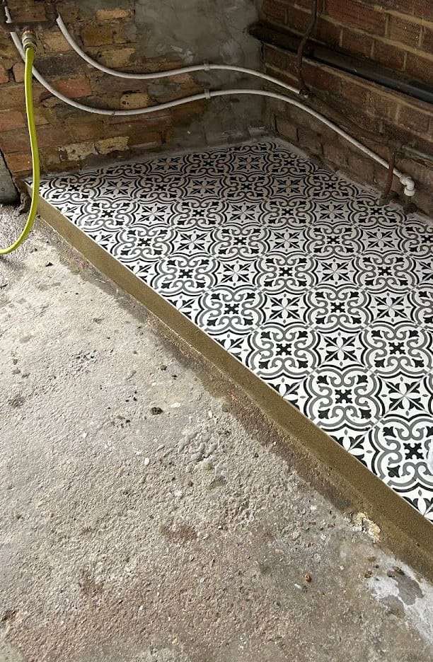 Patterned utility floor, by Cutting Edge Tiling